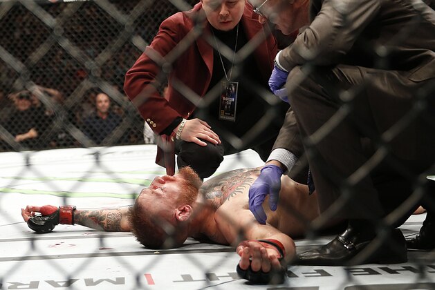 Conor McGregor recovers shortly after a second round-submission to Nate Diaz during their UFC 196 welterweight mixed martial arts match, Saturday, March 5, 2016, in Las Vegas. (AP Photo/Eric Jamison)