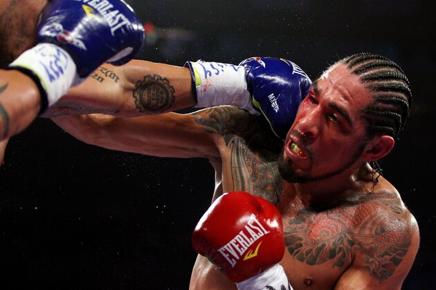 NEW YORK, NY - DECEMBER 03:  Miguel Cotto of Puerto Rico connects with a punch to the right eye of Antonio Margarito of Mexico during the WBA World Junior Middleweight Title fight at Madison Square Garden on December 3, 2011 in New York City.  (Photo by Al Bello/Getty Images)
