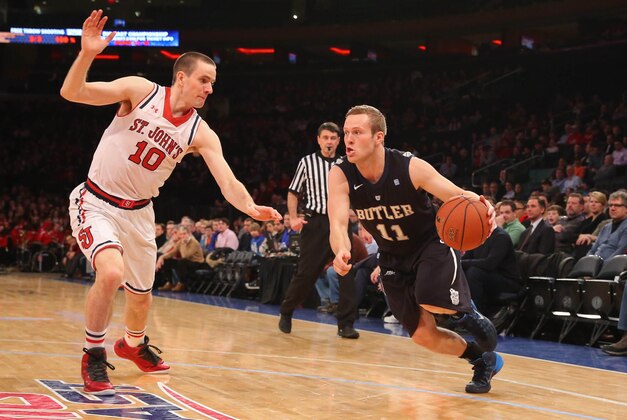 Feb 18, 2014; New York, NY, USA;  Butler Bulldogs guard Jackson Aldridge (11) drives around St. John's Red Storm guard/forward Max Hooper (10) during the first half at Madison Square Garden. Mandatory Credit: Anthony Gruppuso-USA TODAY Sports