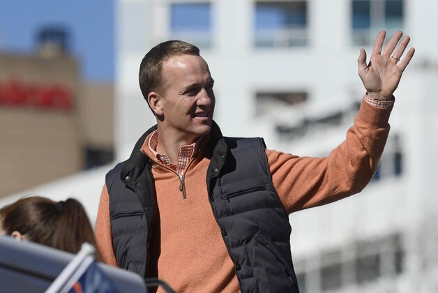 Feb 9, 2016; Denver, CO, USA; Denver Broncos quarterback Peyton Manning waves to the crowd during the Super Bowl 50 championship parade at Civic Center Park. Mandatory Credit: Ron Chenoy-USA TODAY Sports
