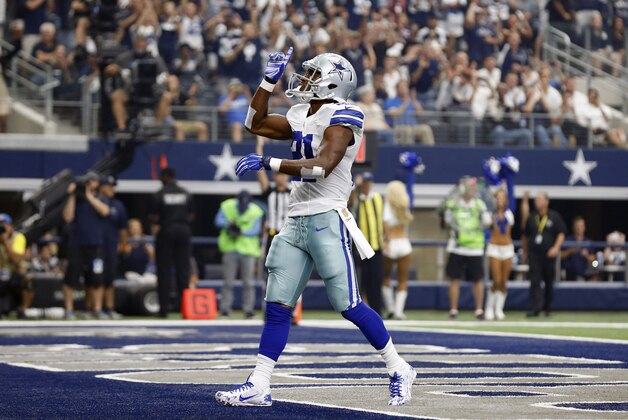 Sep 27, 2015; Arlington, TX, USA; Dallas Cowboys running back Joseph Randle (21) celebrates his second quarter touchdown against the Atlanta Falcons at AT&T Stadium. Mandatory Credit: Matthew Emmons-USA TODAY Sports