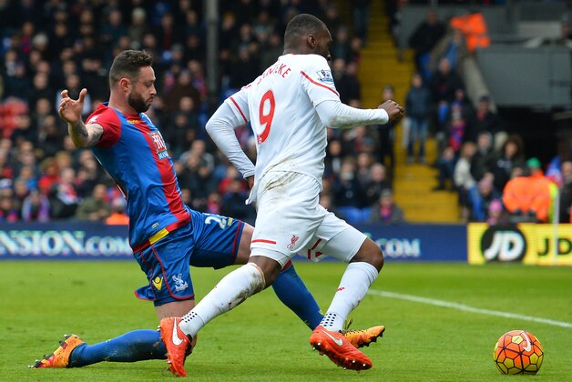 Liverpool's Zaire-born Belgian striker Christian Benteke (R) is fouled in the area by Crystal Palace's Irish defender Damien Delaney leading to a penalty that Benteke converts during the English Premier League football match between Crystal Palace and Liverpool at Selhurst Park in south London on March 6, 2016.
Liverpool won the game 2-1. / AFP / GLYN KIRK / RESTRICTED TO EDITORIAL USE. No use with unauthorized audio, video, data, fixture lists, club/league logos or 'live' services. Online in-match use limited to 75 images, no video emulation. No use in betting, games or single club/league/player publications.  /         (Photo credit should read GLYN KIRK/AFP/Getty Images)