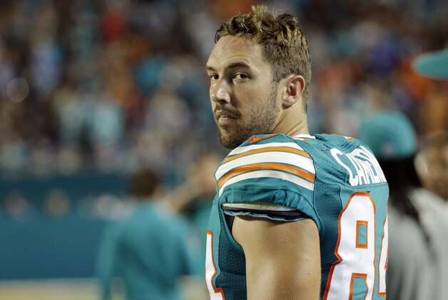 Miami Dolphins tight end Jordan Cameron (84) walks the sidelines during the first half of an NFL football gam against the New York Giants, Monday, Dec. 14, 2015, in Miami Gardens, Fla.  (AP Photo/Wilfredo Lee)