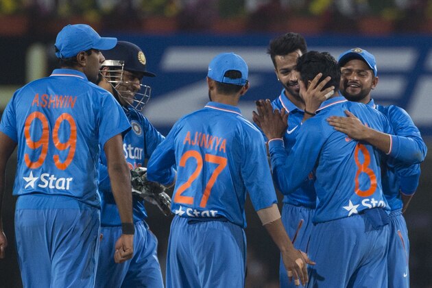 Indian cricketers celebrate the fall of Sri Lankan batsman Tillakaratne Dilshan during the second T20 match of a three match series between the two countries, in Ranchi, India, Friday, Feb. 12, 2016. (AP Photo/Saurabh Das)