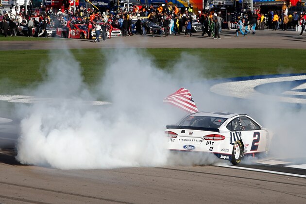 LAS VEGAS, NV - MARCH 06:  Brad Keselowski, driver of the #2 Miller Lite Ford, celebrates with a burnout after winning the NASCAR Sprint Cup Series Kobalt 400 at Las Vegas Motor Speedway on March 6, 2016 in Las Vegas, Nevada.  (Photo by Todd Warshaw/Getty Images)