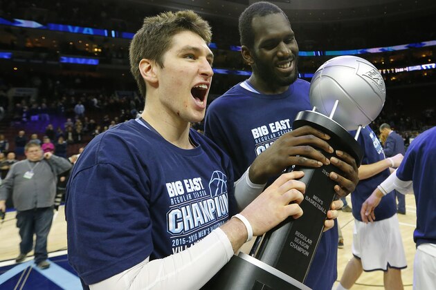 PHILADELPHIA, PA - March 5: Ryan Arcidiacono #15 and Daniel Ochefu #23 of the Villanova Wildcats hold the Big East Regular Season Championship trophy after defeating the Georgetown Hoyas 84-71 in an NCAA college basketball game on March 5, 2016 at the Wells Fargo Center in Philadelphia, Pennsylvania. (Photo by Rich Schultz /Getty Images)
