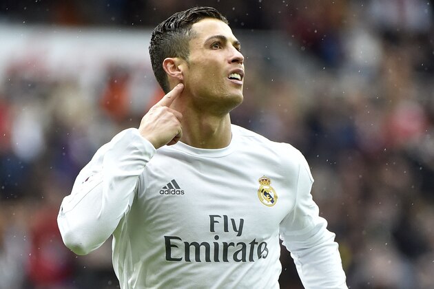 Portuguese forward Cristiano Ronaldo celebrates a goal during the Spanish league football match Real Madrid CF vs RC Celta de Vigo at the Santiago Bernabeu stadium in Madrid on March 5, 2016. / AFP / GERARD JULIEN        (Photo credit should read GERARD JULIEN/AFP/Getty Images)