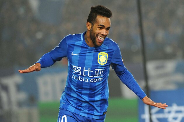 Jiangsu Suning's Alex Teixeira celebrates during the Chinese Super League football between Jiangsu Suning and Shandong Luneng  on March 5, 2016 in Nanjing. / AFP / STR        (Photo credit should read STR/AFP/Getty Images)