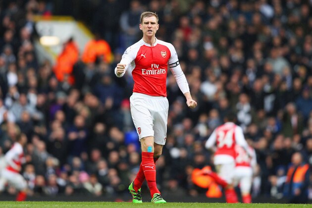 LONDON, ENGLAND - MARCH 05:  Per Mertesacker of Arsenal celebrates his team's first goal during the Barclays Premier League match between Tottenham Hotspur and Arsenal at White Hart Lane on March 5, 2016 in London, England.  (Photo by Paul Gilham/Getty Images)
