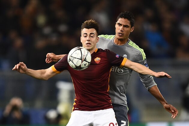 Roma's forward from Italy Stephan El Shaarawy (front) vies with Real Madrid's French defender Raphael Varane during the UEFA Champions League football match AS Roma vs Real Madrid on Frebruary 17, 2016 at the Olympic stadium in Rome.   AFP PHOTO / FILIPPO MONTEFORTE / AFP / FILIPPO MONTEFORTE        (Photo credit should read FILIPPO MONTEFORTE/AFP/Getty Images)
