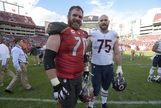 Tampa Bay Buccaneers guard Logan Mankins (70) and Chicago Bears offensive tackle Kyle Long (75) chat on the field after an NFL football game in Tampa, Fla., Sunday, Dec. 27, 2015. The Bears won 26-21. (AP Photo/Phelan M. Ebenhack)