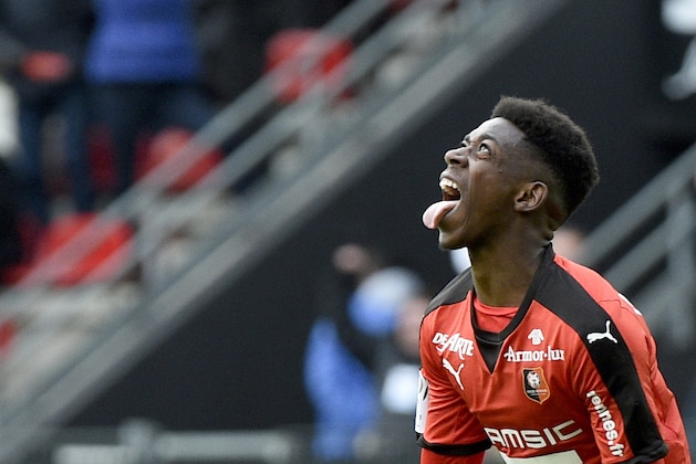 Rennes' French forward Ousmane Dembele celebrates after scoring  a goal during the French L1 football match between Rennes (SRFC) and Nantes (FCN) on March 6, 2016 at the Roazhon Park stadium in Rennes, western France. AFP PHOTO / DAMIEN MEYER / AFP / DAMIEN MEYER        (Photo credit should read DAMIEN MEYER/AFP/Getty Images)