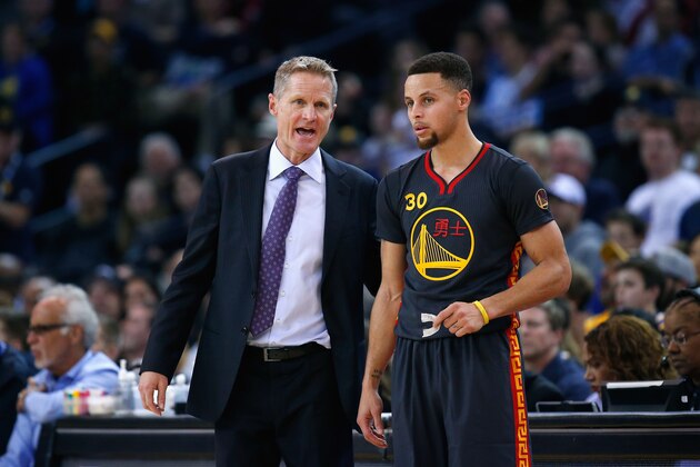 OAKLAND, CA - FEBRUARY 09:  Head coach Steve Kerr of the Golden State Warriors talks to Stephen Curry #30 during their game against the Houston Rockets at ORACLE Arena on February 9, 2016 in Oakland, California.  NOTE TO USER: User expressly acknowledges and agrees that, by downloading and or using this photograph, User is consenting to the terms and conditions of the Getty Images License Agreement.  (Photo by Ezra Shaw/Getty Images)