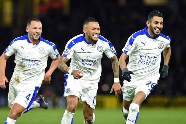 Leicester City's Algerian midfielder Riyad Mahrez (R) celebrates scoring his team's first goal with Leicester City's English midfielder Danny Drinkwater and Leicester City's Ghanaian midfielder Daniel Amartey (C) during the English Premier League football match between Watford and Leicester City at Vicarage Road Stadium in Watford, north of London on March 5, 2016. / AFP / OLLY GREENWOOD / RESTRICTED TO EDITORIAL USE. No use with unauthorized audio, video, data, fixture lists, club/league logos or 'live' services. Online in-match use limited to 75 images, no video emulation. No use in betting, games or single club/league/player publications.  /         (Photo credit should read OLLY GREENWOOD/AFP/Getty Images)