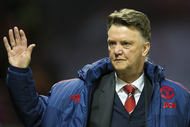 Manchester United's manager Louis van Gaal waves as he takes to the touchline before the English Premier League soccer match between Manchester United and Stoke at Old Trafford Stadium, Manchester, England, Tuesday, Feb. 2, 2016. (AP Photo/Jon Super)