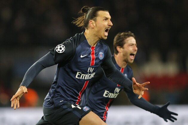 PSG's Zlatan Ibrahimovic, center,  celebrates with PSG's Maxwell his opening goal during the Champions League round of 16, 1st leg soccer match between Paris Saint Germain and Chelsea at the Parc des Princes stadium in Paris, France, Tuesday, Feb. 16, 2016. (AP Photo/Christophe Ena)