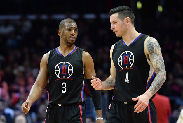 Mar 5, 2016; Los Angeles, CA, USA; Los Angeles Clippers guard Chris Paul (3) and guard J.J. Redick (4) talk during the fourth quarter against the Atlanta Hawks at Staples Center. Mandatory Credit: Jake Roth-USA TODAY Sports