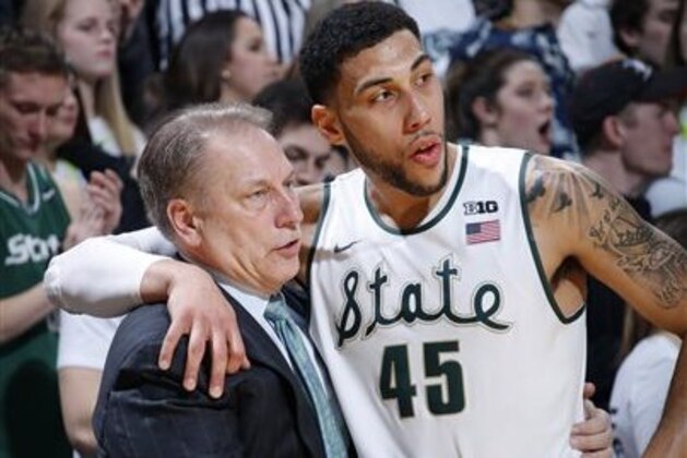 FILE - In this Feb. 18, 2016, file photo, Michigan State coach Tom Izzo talks with Denzel Valentine during the second half of the team's NCAA college basketball game against Wisconsin, in East Lansing, Mich. Michigan State is scoring more than it ever has under Tom Izzo. The Spartans are averaging an Izzo-high 79.4 points a game with Denzel Valentine directing an offense with options inside and out. (AP Photo/Al Goldis, File)