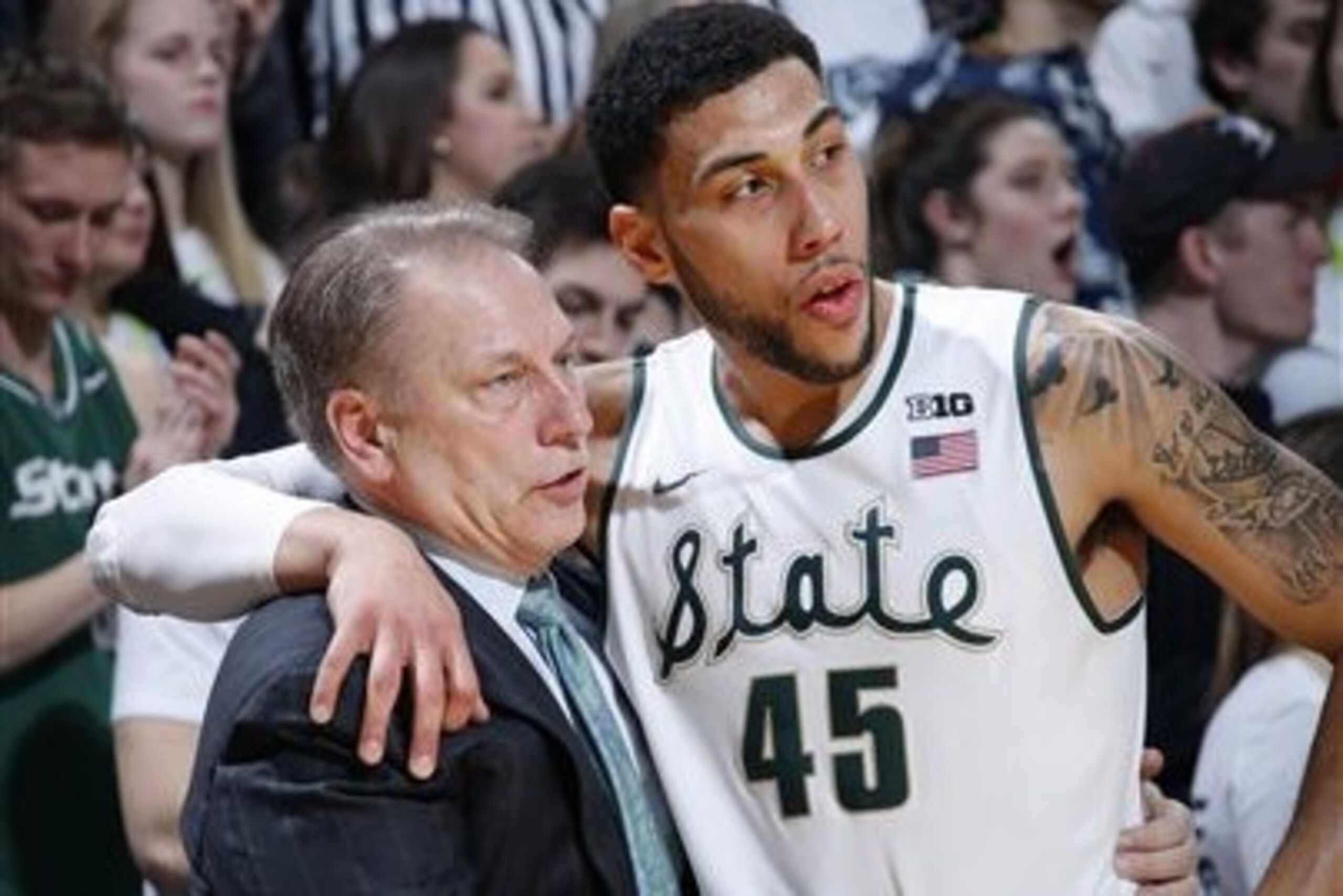 FILE - In this Feb. 18, 2016, file photo, Michigan State coach Tom Izzo talks with Denzel Valentine during the second half of the team's NCAA college basketball game against Wisconsin, in East Lansing, Mich. Michigan State is scoring more than it ever has under Tom Izzo. The Spartans are averaging an Izzo-high 79.4 points a game with Denzel Valentine directing an offense with options inside and out. (AP Photo/Al Goldis, File)
