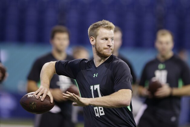 North Dakota State quarterback Carson Wentz runs a drill at the NFL football scouting combine on Saturday, Feb. 27, 2016, in Indianapolis. (AP Photo/Darron Cummings)