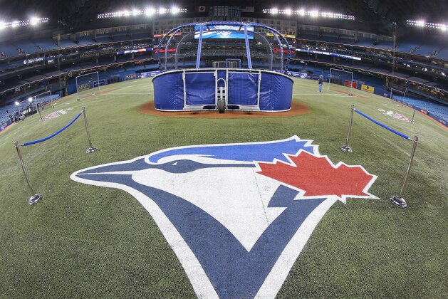 TORONTO, CANADA - APRIL 4: The Toronto Blue Jays logo painted on the field during batting practice before the Toronto Blue Jays home opener prior to the start of their MLB game against the New York Yankees on April 4, 2014 at Rogers Centre in Toronto, Ontario, Canada. (Photo by Tom Szczerbowski/Getty Images)