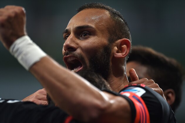 Leverkusen's Turkish defender Oemer Toprak celebrates during the German first division Bundesliga football match Bayer 04 Leverkusen vs Borussia Moenchengladbach in Leverkusen, western Germany, on December 12, 2015. AFP PHOTO / PATRIK STOLLARZ

RESTRICTIONS: DURING MATCH TIME: DFL RULES TO LIMIT THE ONLINE USAGE TO 15 PICTURES PER MATCH AND FORBID IMAGE SEQUENCES TO SIMULATE VIDEO. == RESTRICTED TO EDITORIAL USE == FOR FURTHER QUERIES PLEASE CONTACT DFL DIRECTLY AT + 49 69 650050. / AFP / PATRIK STOLLARZ        (Photo credit should read PATRIK STOLLARZ/AFP/Getty Images)