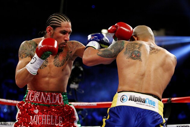 NEW YORK, NY - DECEMBER 03:  Antonio Margarito (L) of Mexico throws a punch against Miguel Cotto of Puerto Rico in the first round during the WBA World Junior Middleweight Title fight at Madison Square Garden on December 3, 2011 in New York City.  (Photo by Al Bello/Getty Images)