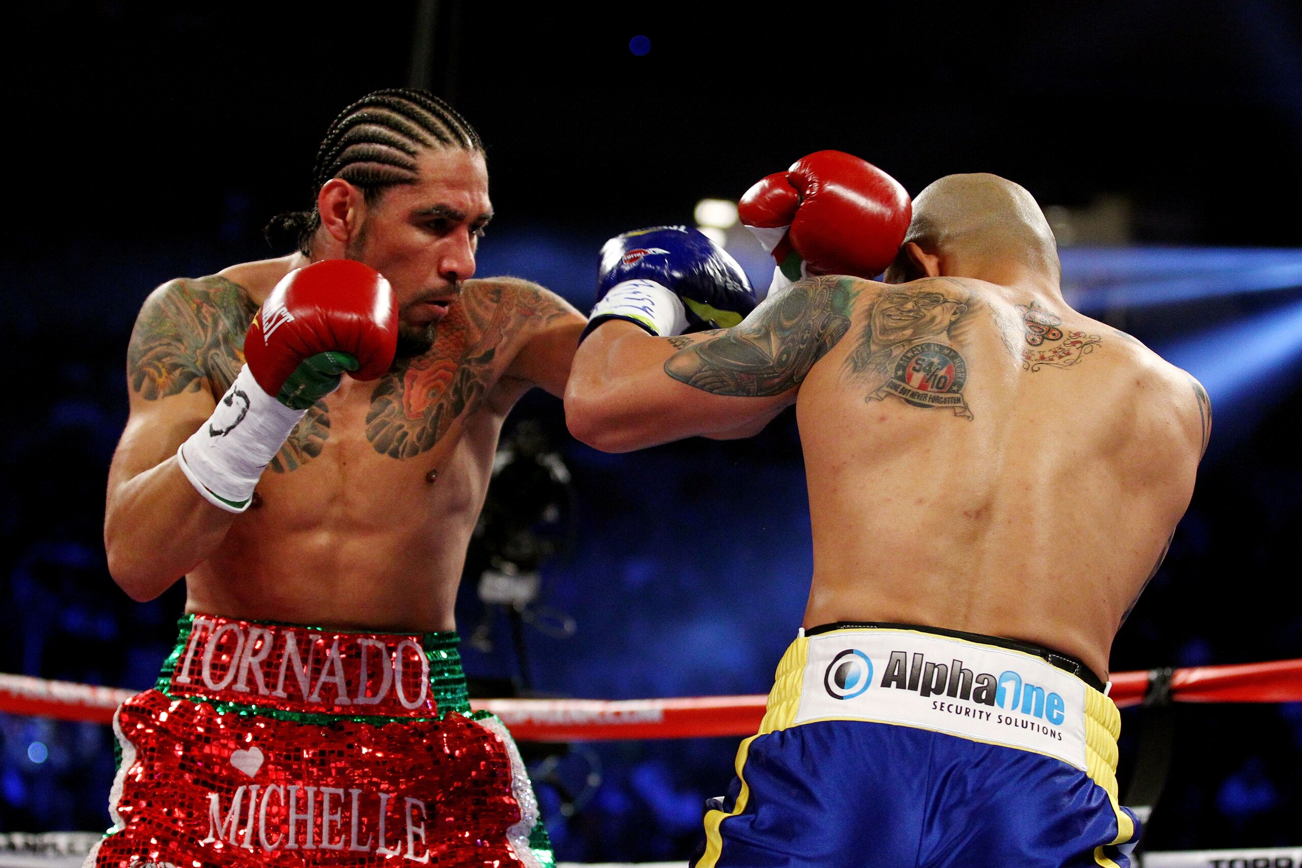 NEW YORK, NY - DECEMBER 03:  Antonio Margarito (L) of Mexico throws a punch against Miguel Cotto of Puerto Rico in the first round during the WBA World Junior Middleweight Title fight at Madison Square Garden on December 3, 2011 in New York City.  (Photo by Al Bello/Getty Images)