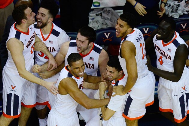 CHARLOTTESVILLE, VA - MARCH 05:  Malcolm Brogdon #15 of the Virginia Cavaliers celebrates with his teammates after Caid Kirven #24 (not pictured) made a three-point field goal in the second half during their game against the Louisville Cardinals at John Paul Jones Arena on March 5, 2016 in Charlottesville, Virginia.  (Photo by Patrick McDermott/Getty Images)