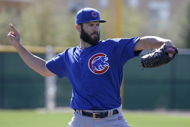 Chicago Cubs starting pitcher Jake Arrieta throws during a spring baseball practice in Mesa, Ariz., Saturday, Feb. 20, 2016. (AP Photo/Chris Carlson)