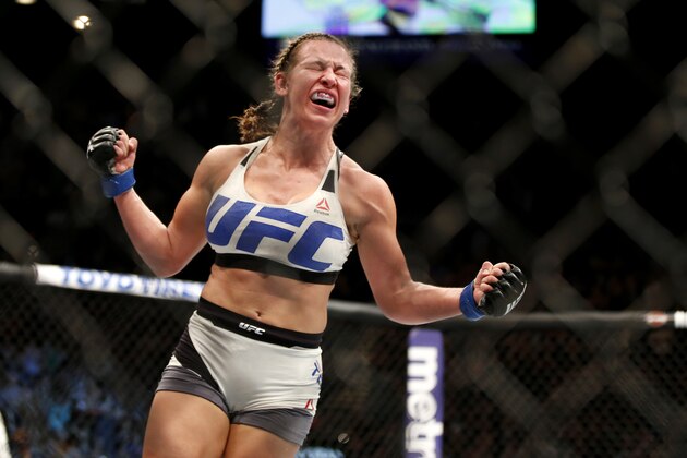 Miesha Tate celebrates victory over Holly Holm in their UFC 196 women’s bantamweight mixed martial arts match Saturday, March 5, 2016, in Las Vegas. (AP Photo/Eric Jamison)