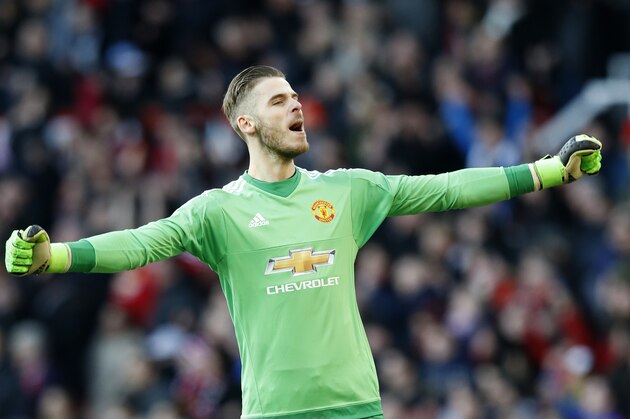 manchester United's goalkeeper David de Gea celebrates towards the fans following the end of the English Premier League soccer match between Manchester United and Arsenal at Old Trafford Stadium, Manchester, England, Sunday, Feb. 28, 2016. Manchester United won the game 3-2. (AP Photo/Jon Super)