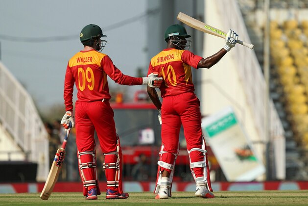 Zimbabwe's Vusi Sibanda acknowledges the crowd afer scoring a half-century (50 runs) during the opening match of the T20 Cricket World Cup against Hong Kong in the Indian town of Nagpur on March 8, 2016. 
 / AFP / STRINGER        (Photo credit should read STRINGER/AFP/Getty Images)