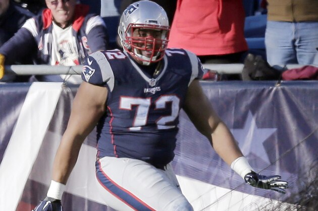 New England Patriots defensive tackle Akiem Hicks celebrates after recovering a loose ball for a touchdown after it was stripped from Tennessee Titans quarterback Marcus Mariota in the first half of an NFL football game, Sunday, Dec. 20, 2015, in Foxborough, Mass. (AP Photo/Charles Krupa)