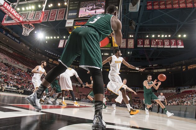 DETROIT, MI - MARCH 07: Khalil Small #3 of the Green Bay Phoenix in-bounds the ball to teammate Jordan Fouse  #4 against the Valparaiso Crusaders during game one of the Horizon League Basketball Tournament - Semifinals at Joe Louis Arena on March 7, 2016 in Detroit, Michigan. The Green Bay Phoenix defeated the Valparaiso Crusaders 99-92. (Photo by Dave Reginek/Getty Images)