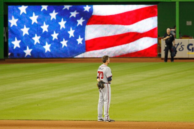 MIAMI, FL - SEPTEMBER 27:  Pitcher Daniel Winkler #70 of the Atlanta Braves stands during singing of 'God Bless America' in the seventh inning of play against the Miami Marlins at Marlins Park on September 27, 2015 in Miami, Florida.  (Photo by Joe Skipper/Getty Images)