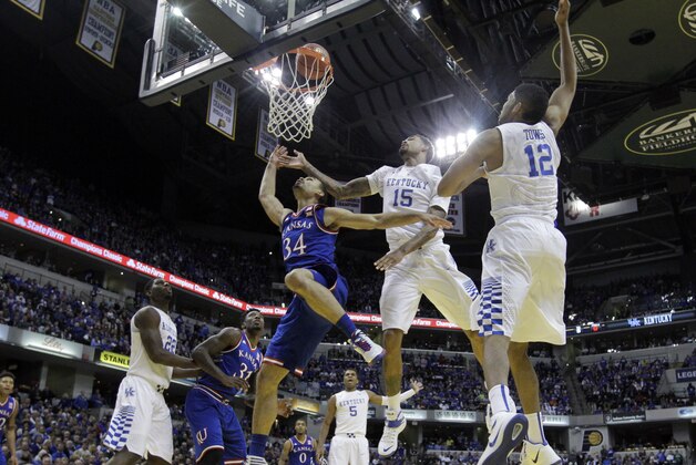 Kansas's Perry Ellis (34) puts up a shot during the first half of an NCAA college basketball game against the Kentucky, Tuesday, Nov. 18, 2014, in Indianapolis. (AP Photo/Darron Cummings)