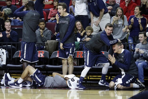 Monmouth players react on the bench to a play during the first half of an NCAA college basketball game against Rutgers, Sunday, Dec. 20, 2015, in Piscataway, N.J.  (AP Photo/Mel Evans)