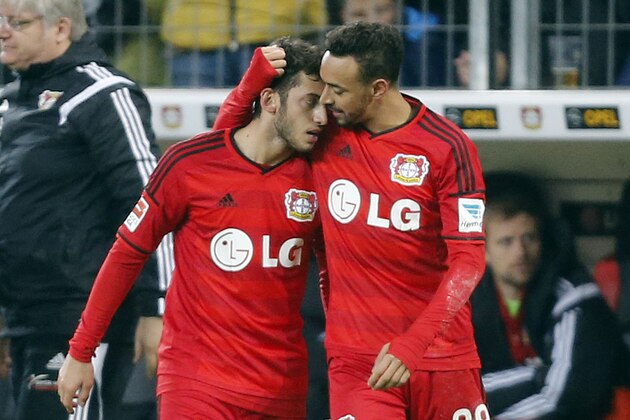 Leverkusen's Hakan Calhanoglu from Turkey, left, and Karim Bellarabi celebrate after scoring during the German first division Bundesliga soccer match between Bayer Leverkusen and 1.FC Cologne in Leverkusen, Germany, Saturday, Nov. 29, 2014. (AP Photo/Frank Augstein) Leverkusen's Hakan Calhanoglu from Turkey, left, and Karim Bellarabi celebrate after scoring during the German first division Bundesliga soccer match between Bayer Leverkusen and 1.FC Cologne in Leverkusen, Germany, Saturday, Nov. 29, 2014. (AP Photo/Frank Augstein)