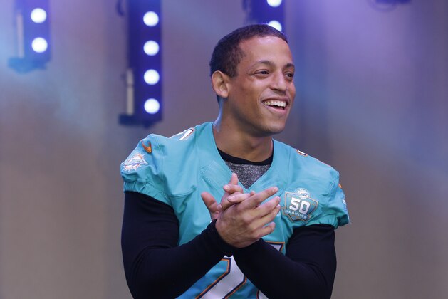 Miami Dolphins cornerback Brent Grimes speaks on stage during an NFL fan rally in Trafalgar Square, in London, Saturday, Oct. 3, 2015. The Miami Dolphins are playing the  New York Jets in an NFL football game at London's Wembley stadium on Sunday. (AP Photo/Matt Dunham)