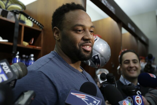 New England Patriots defensive end Akiem Hicks speaks with reporters in the team's locker room at Gillette Stadium before an NFL football practice, Wednesday, Jan. 13, 2016, in Foxborough, Mass. The Patriots are to host the Kansas City Chiefs in an NFL divisional playoff game Jan. 16, 2016, in Foxborough. (AP Photo/Steven Senne)