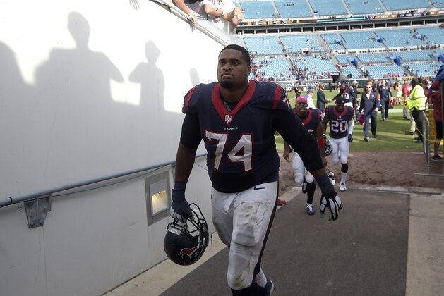 Houston Texans tackle Chris Clark (74) heads to the locker room after an NFL football game against the Jacksonville Jaguars in Jacksonville, Fla., Sunday, Oct. 18, 2015. (AP Photo/Phelan M. Ebenhack)