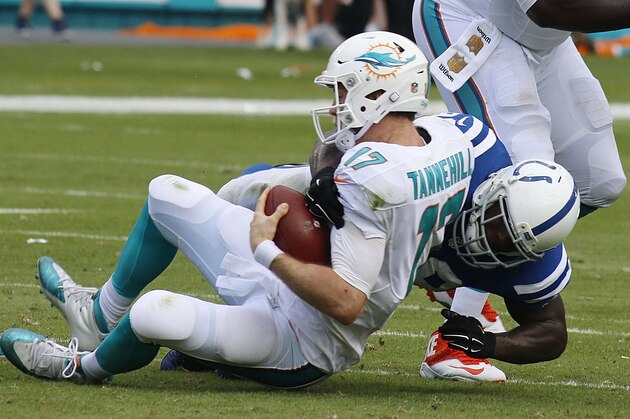 Miami Dolphins quarterback Ryan Tannehill (17) is sacked by Indianapolis Colts outside linebacker Robert Mathis (98) during the first half of an NFL football game, Sunday, Dec. 27, 2015, in Miami Gardens, Fla.  (AP Photo/Joe Skipper)