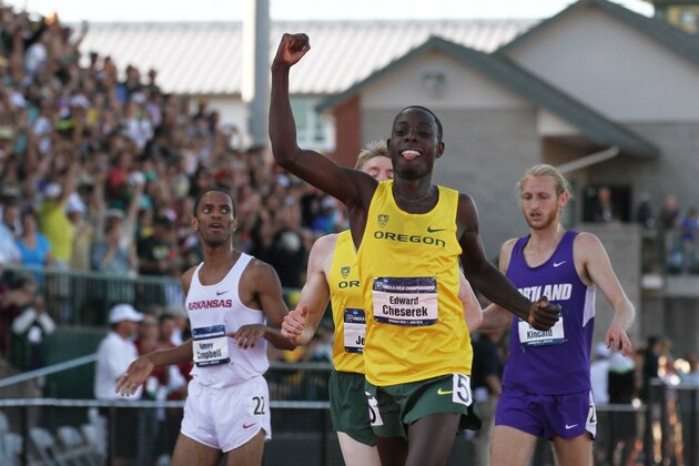 Oregon's Edward Cheserek fist-pumps after winning the men's 5000-meter run during the NCAA track and field championships in Eugene, Ore., Friday, June 12, 2015. (AP Photo/Ryan Kang)