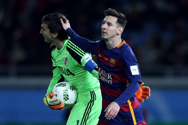 YOKOHAMA, JAPAN - DECEMBER 20: Marcelo Barovero of River Plate is embraced by Lionel Messi of Barcelona during the FIFA Club World Cup Final match between River Plate and Barcelona at the International Stadium Yokohama on December 20, 2015 in Yokohama, Japan. (Photo by Chris Brunskill Ltd/Getty Images)