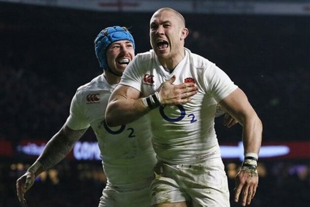 England's Mike Brown, right, celebrates with Jack Nowell after scoring his side's second try during the Six Nations international rugby match between England and Ireland at Twickenham stadium in London, Saturday, Feb. 27, 2016. (AP Photo/Kirsty Wigglesworth)