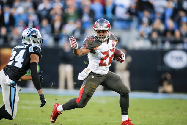 Tampa Bay Buccaneers running back Doug Martin (22) runs the ball against the Carolina Panthers during an NFL game in Charlotte, N.C. on Sunday, Jan. 3, 2016. (Chris Keane/AP Images for Panini)