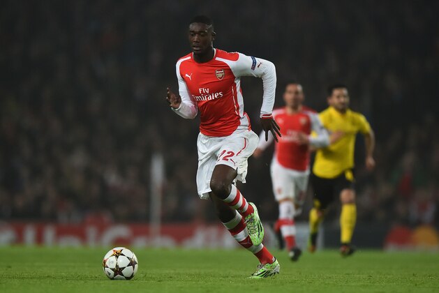 Arsenal's French striker Yaya Sanogo runs with the ball during the UEFA Champions League Group D football match between Arsenal and Borussia Dortmund at the Emirates Stadium in north London on November 26, 2014. AFP PHOTO / BEN STANSALL        (Photo credit should read BEN STANSALL/AFP/Getty Images)
