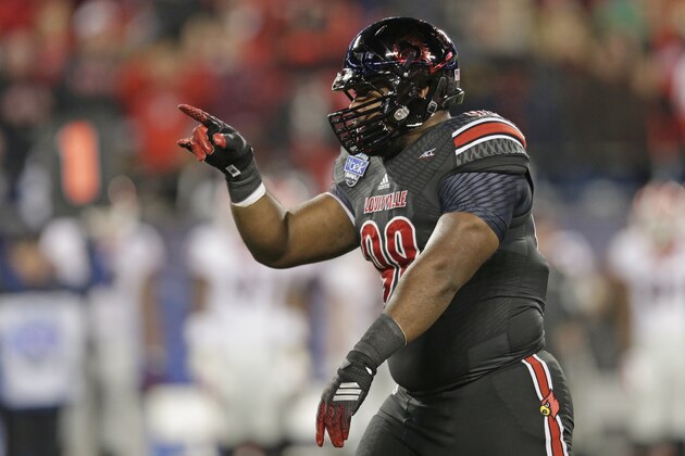 Louisville's Sheldon Rankins (98) reacts after sacking the Georgia quarterback during the first half of the Belk Bowl NCAA college football game in Charlotte, N.C., Tuesday, Dec. 30, 2014. (AP Photo/Chuck Burton)