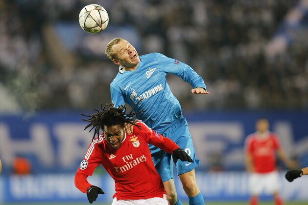 Benfica’s Renato Sanches, left, and Zenit's Alexander Anyukov head for the ball during the Champions League League Round of 16 second leg soccer match between Zenit and Benfica at Petrovsky stadium in St.Petersburg, Russia, Wednesday, March 9, 2016. (AP Photo/Dmitri Lovetsky)